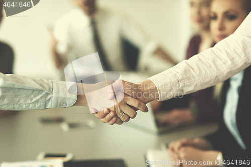 Image of business womans handshake