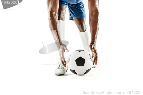 Image of legs of soccer player close-up isolated on white