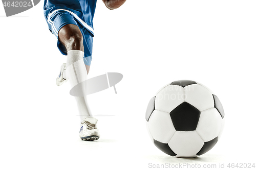 Image of legs of soccer player close-up isolated on white