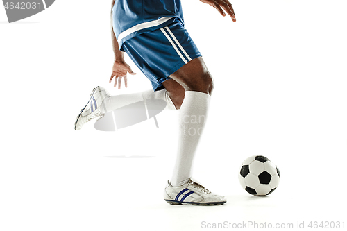 Image of legs of soccer player close-up isolated on white