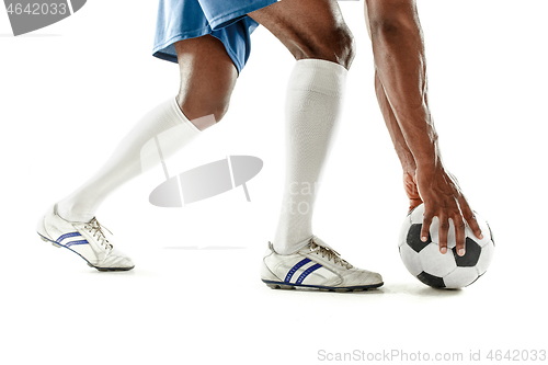 Image of legs of soccer player close-up isolated on white