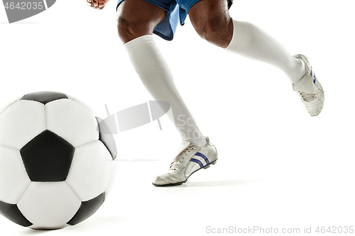 Image of legs of soccer player close-up isolated on white