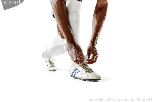 Image of legs of soccer player close-up isolated on white