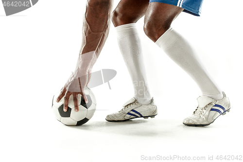 Image of legs of soccer player close-up isolated on white