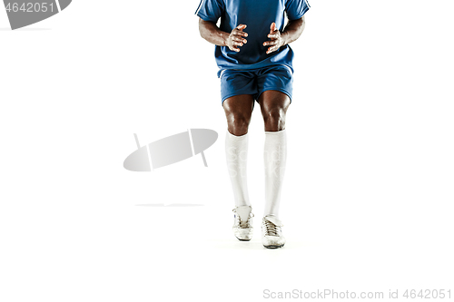 Image of legs of soccer player close-up isolated on white