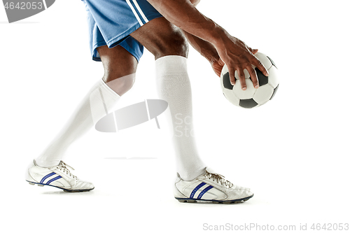 Image of legs of soccer player close-up isolated on white