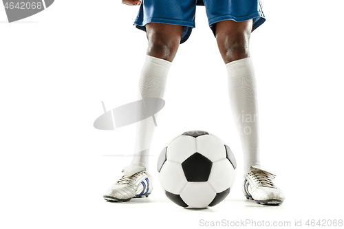 Image of legs of soccer player close-up isolated on white