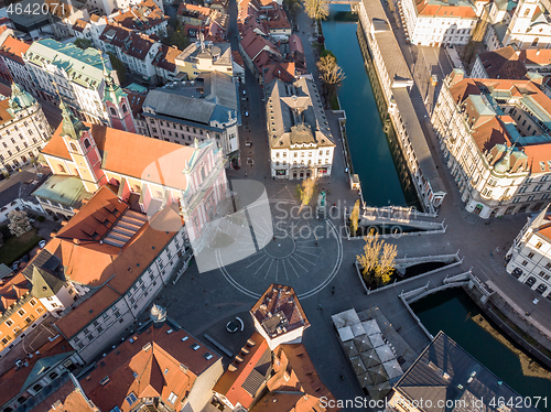 Image of Aerial drone view of Preseren Squere and Triple Bridge over Ljubljanica river,Tromostovje, Ljubljana, Slovenia. Empty streets during corona virus pandemic social distancing measures