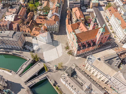 Image of Aerial drone view of Preseren Squere and Triple Bridge over Ljubljanica river,Tromostovje, Ljubljana, Slovenia. Empty streets during corona virus pandemic social distancing measures