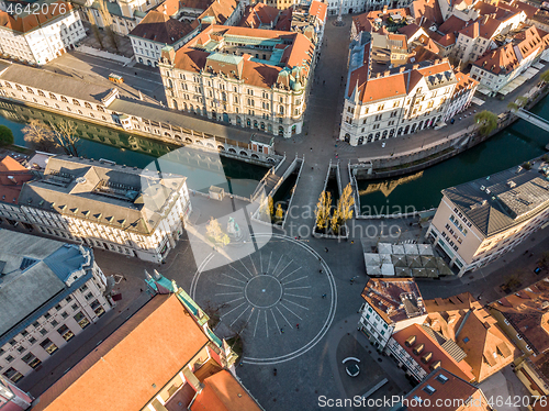 Image of Aerial drone view of Preseren Squere and Triple Bridge over Ljubljanica river,Tromostovje, Ljubljana, Slovenia. Empty streets during corona virus pandemic social distancing measures