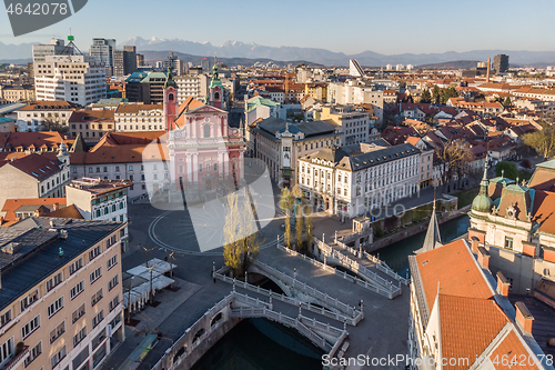 Image of Aerial drone view of Preseren Squere and Triple Bridge over Ljubljanica river,Tromostovje, Ljubljana, Slovenia. Empty streets during corona virus pandemic social distancing measures