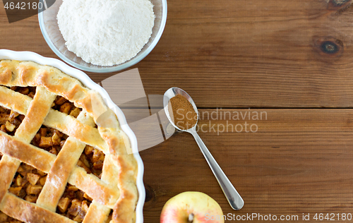 Image of close up of apple pie on wooden table