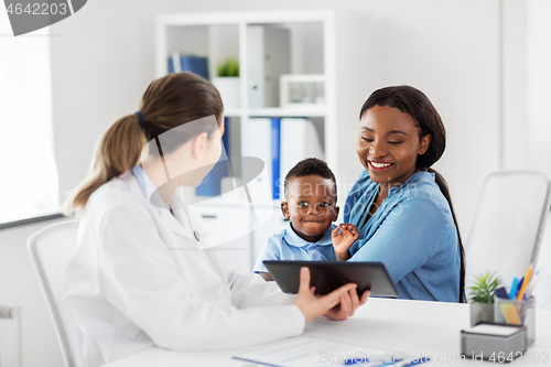 Image of mother with baby and doctor with tablet at clinic