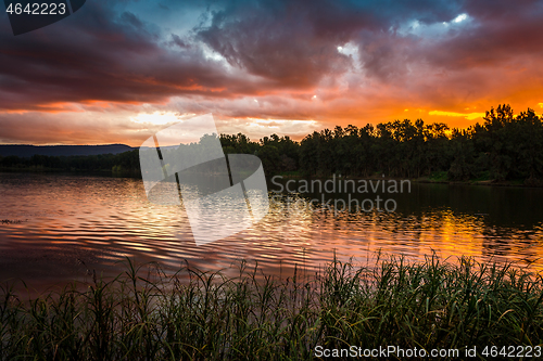 Image of Stormy sunset over water