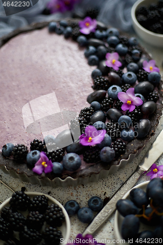 Image of Sweet and tasty tart with fresh blueberries, blackberries and gr