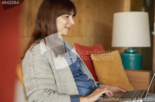 Image of Woman working on a laptop 