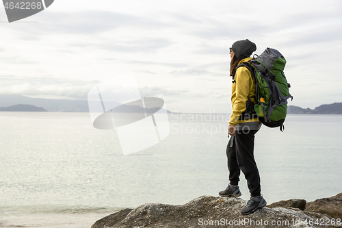 Image of Woman exploring the coast