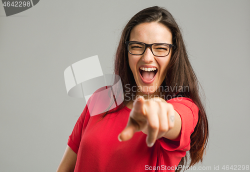 Image of Happy woman pointing to the camera