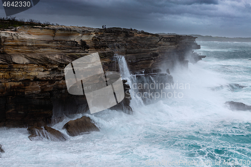 Image of Large swells batter the cliffs of Sydney