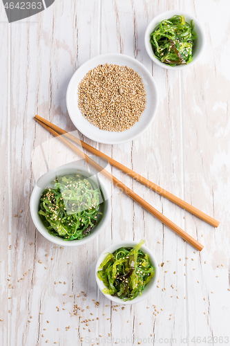 Image of Traditional Japanese wakame salad with sesam seeds. Healthy seaweed salad.