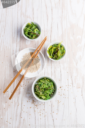 Image of Traditional Japanese wakame salad with sesam seeds. Healthy seaweed salad.