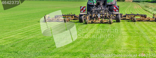 Image of Industrial lawn mower cutting the grass