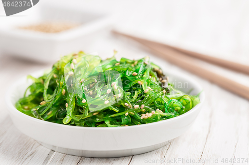 Image of Traditional Japanese wakame salad with sesam seeds. Healthy seaweed salad.