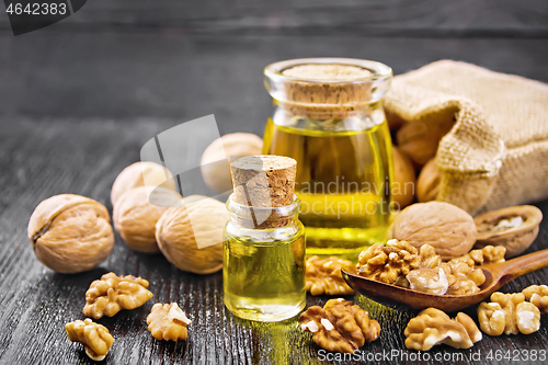 Image of Oil walnut in two jars on dark board