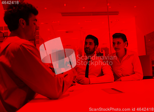 Image of young couple signing contract documents on partners back