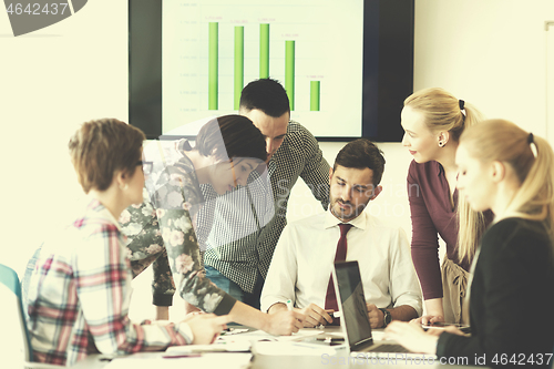 Image of young business people group on meeting at modern office