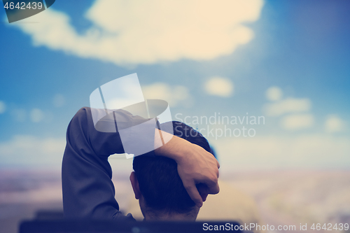 Image of young man dreaming clouds on presentation