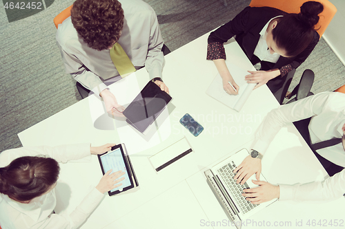 Image of aerial view of business people group brainstorming on meeting