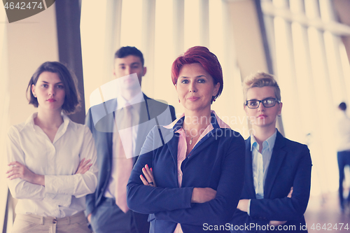 Image of diverse business people group with redhair  woman in front