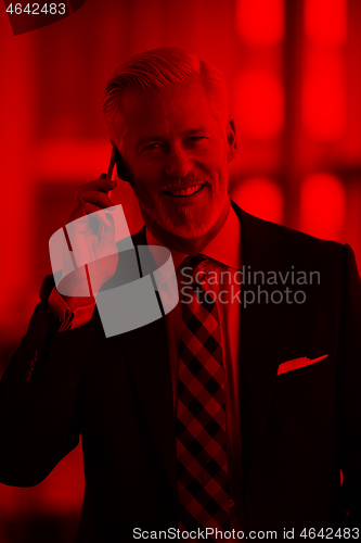 Image of senior business man talk on mobile phone