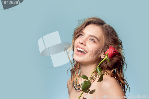 Image of Beautiful young girl in studio with pearl jewelry - earrings, bracelet, necklace.