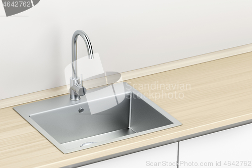 Image of Silver faucet and sink in the kitchen