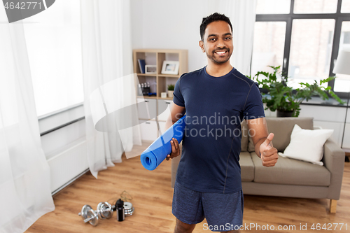 Image of indian man with fitness tracker showing thumbs up