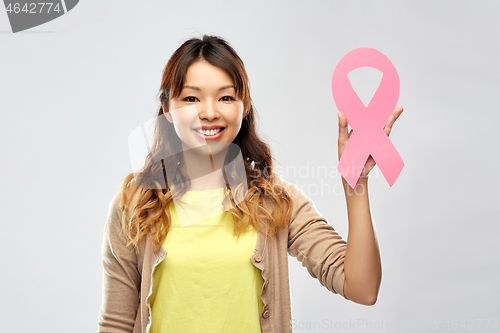 Image of asian woman with breast cancer awareness ribbon