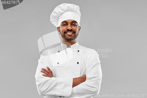 Image of happy male indian chef in toque