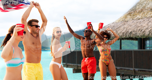 Image of friends at american independence day beach party