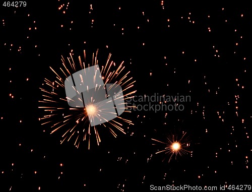Image of Fireworks exploding in black sky full of sparkles