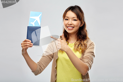 Image of african woman with passport and air ticket