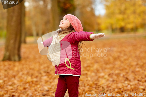 Image of happy girl at autumn park