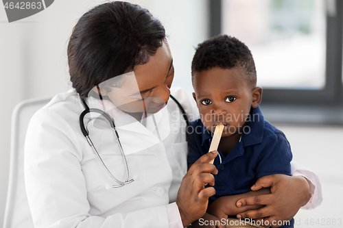 Image of doctor or pediatrician with baby patient at clinic