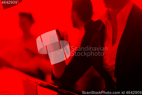 Image of woman hands holding pen on business meeting