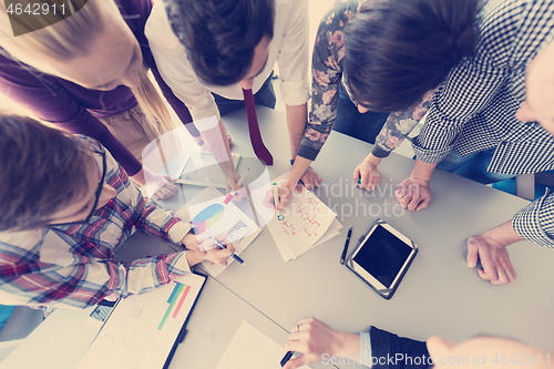 Image of top  view of business people group brainstorming on meeting