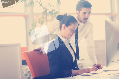 Image of business couple working together on project