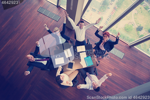 Image of happy business people group on meeting at modern office