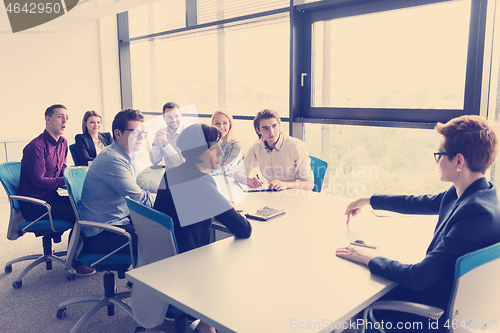 Image of Group of young people meeting in startup office