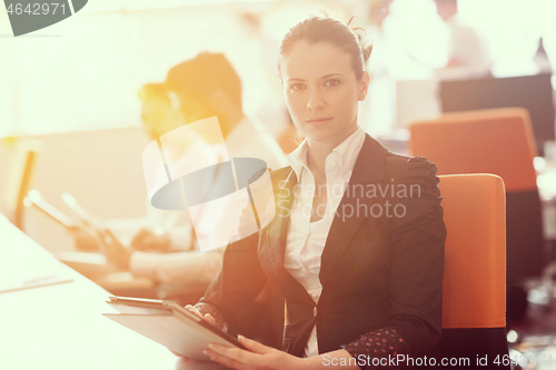 Image of business woman at  office people group on meeting  in background